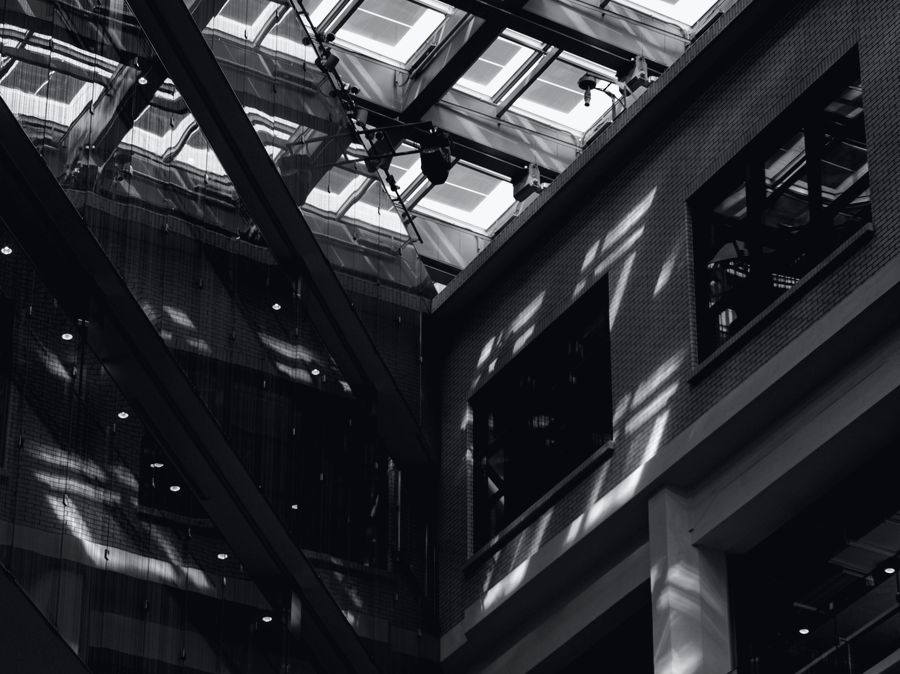 A glass atrium roof seen from below.